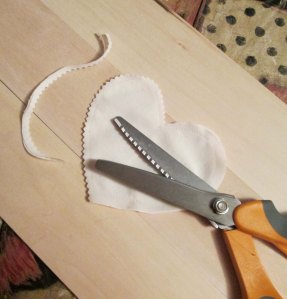 Trim seams to 1/8 inch before turning the shape. Pinking shears are great for this as the little teeth allow the material to give while stuffing. If you don't have pinking shears, make small slits around curves (not too close to stitching) to let the material give.